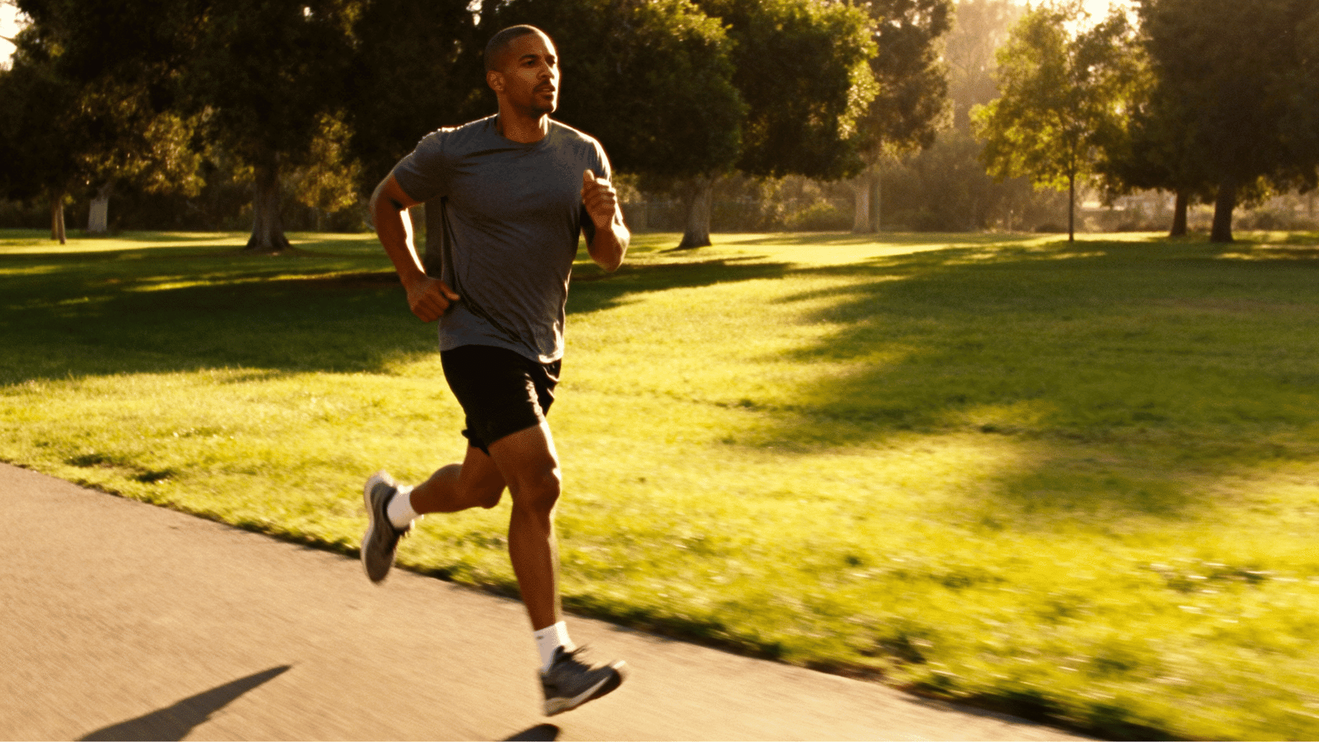 a person running in the park showing cardio muscular endurance