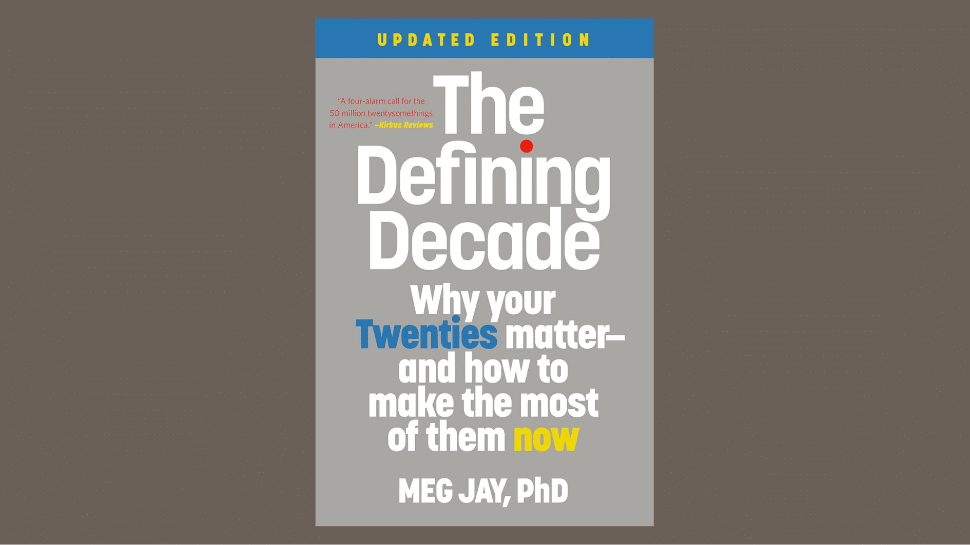 the defining decade book cover by meg jay with large white text on a gray background and blue and yellow accents